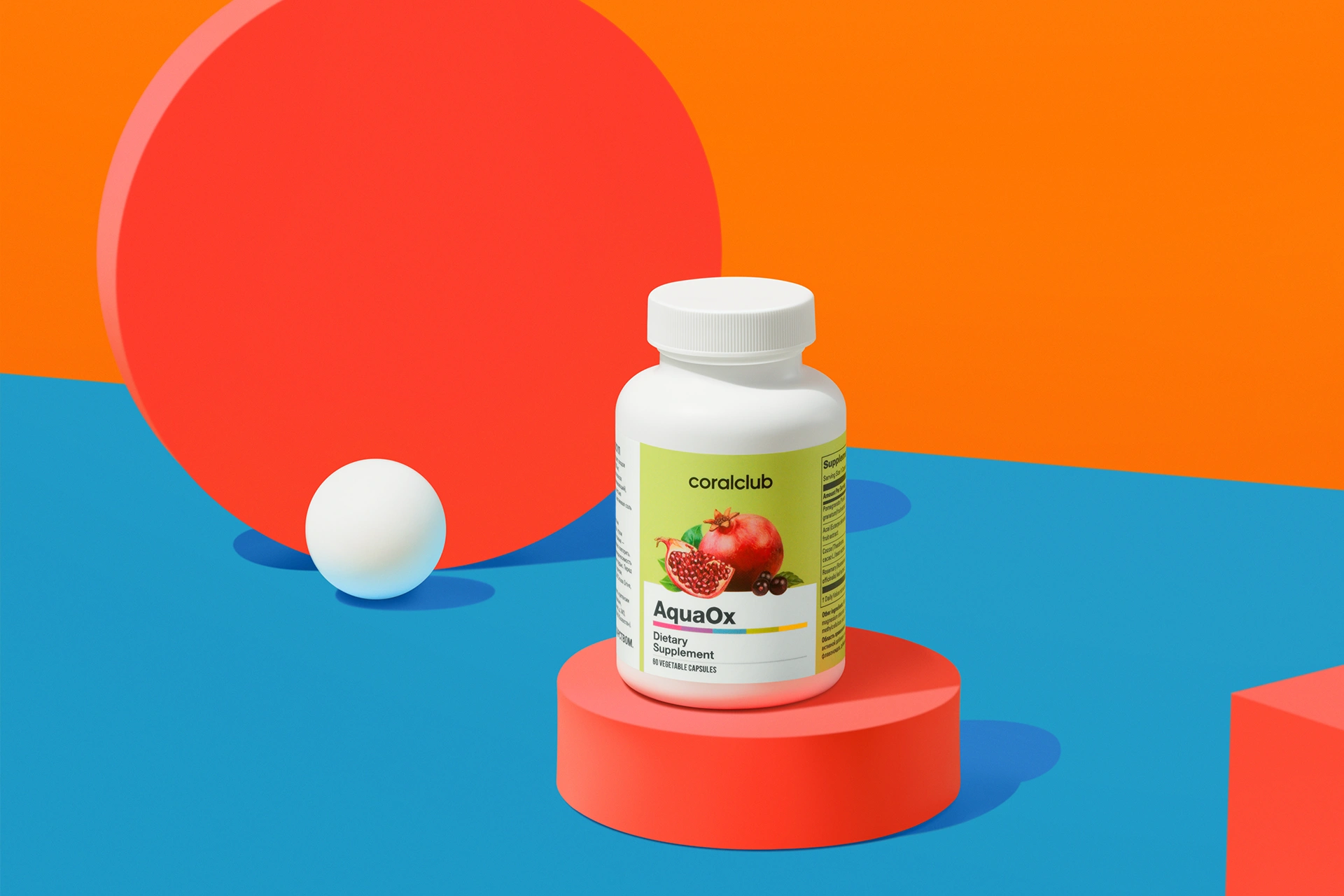 AquaOx capsules in a lifestyle setting next to fresh pomegranate and cocoa beans