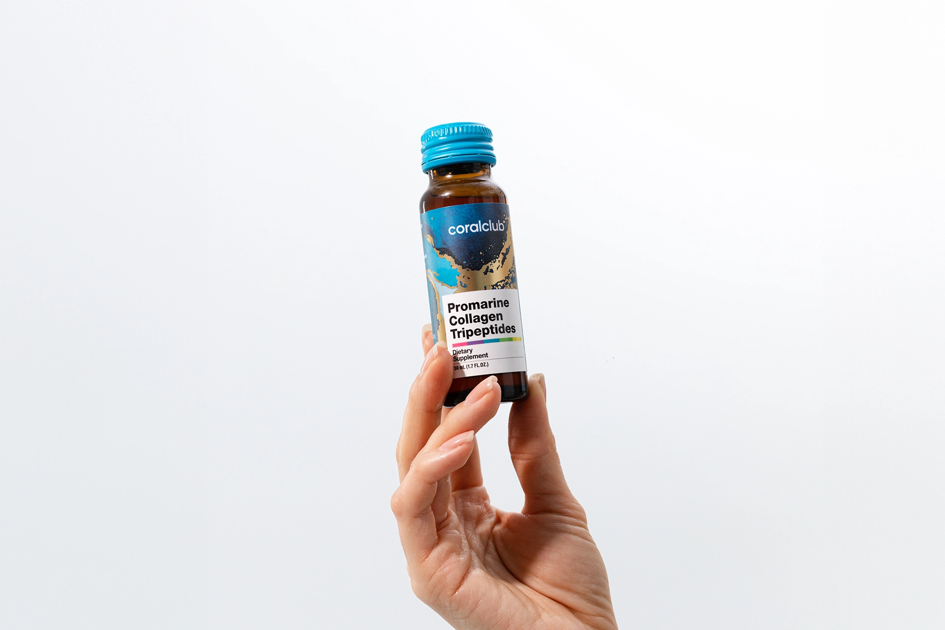 Elegant presentation: Promarine Collagen Tripeptides bottle in hand against morning light