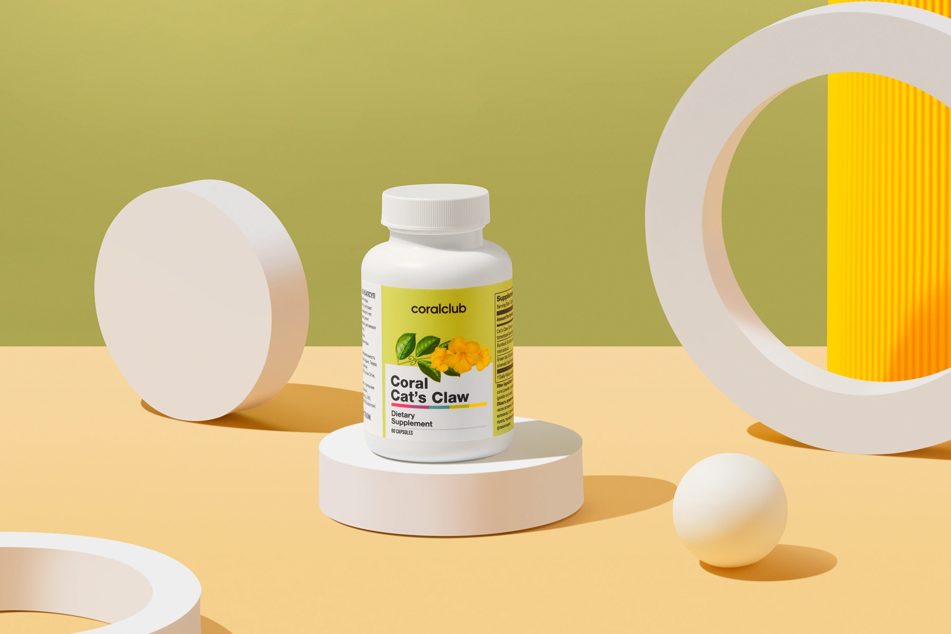Coral Cat's Claw capsules set against fresh green tea leaves and natural wood textures